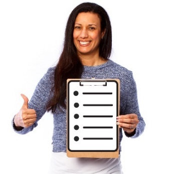 A smiling woman holding a clipboard with a checklist on it and giving a thumbs up.