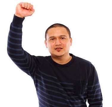 A man is raising his fist in the air to show being independent.