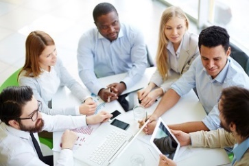 A group of people in a meeting.