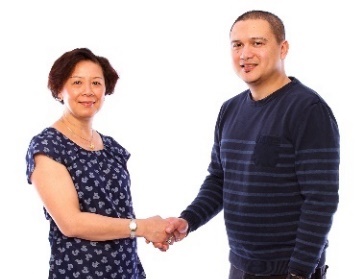 A man and a woman shaking hands.