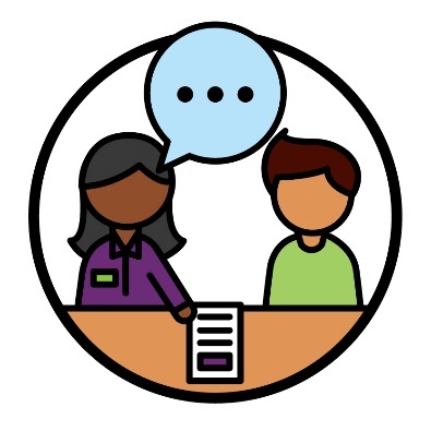 An NDIA worker supporting someone to look at an NDIS document.