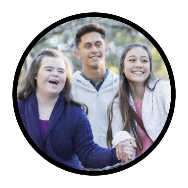3 people smiling in a park.
