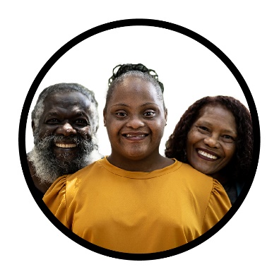 2 parents and a young person smiling.