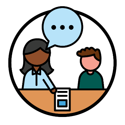 2 people at a table with a document in front of them. There is a speech bubble between them.