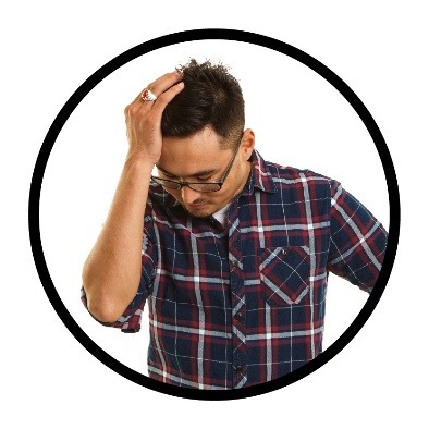 A person with their hand on their head looking stressed.