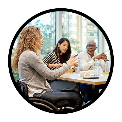 A group of people talking at a table.