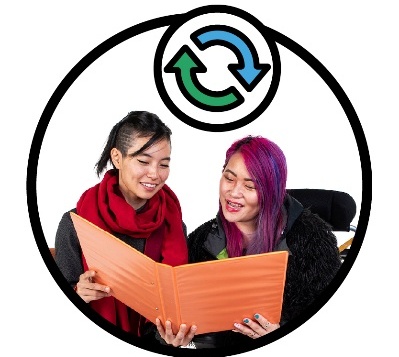 2 people looking at a document and smiling. Above is a change icon.