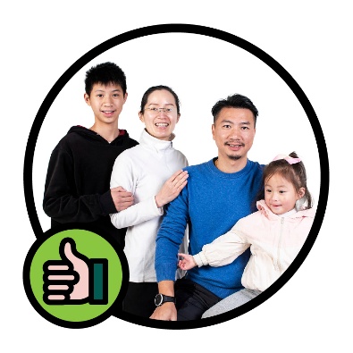A family one 2 adults and 2 kids next to a thumbs up.