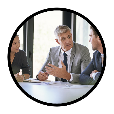 A group of 3 people in a meeting.