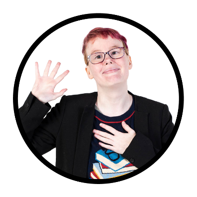 A young person with disability pointing to themself and smiling.