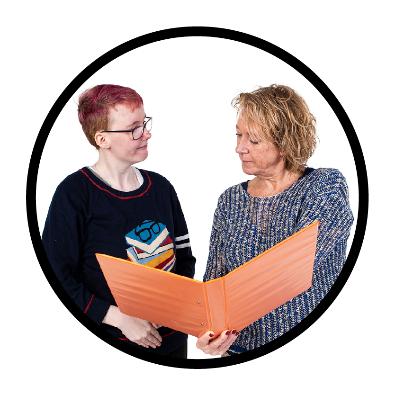 A person supporting someone else to read a document. They are looking at a folder together.