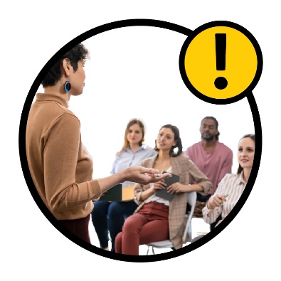 A person speaking in front of a group of LACs. An importance icon is above them.