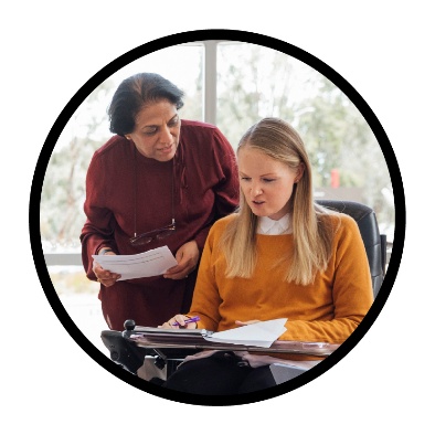 2 people looking at documents.