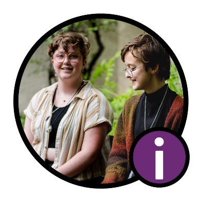 2 people smiling. An information icon is below them.