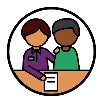 A participant being supported to read a document.