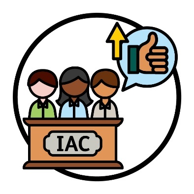 3 people behind a bench that says 'IAC'. Above them is a speech bubble that shows a thumbs up with an arrow pointing up.
