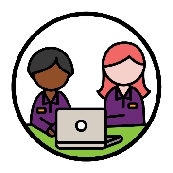 2 NDIA workers with a laptop.