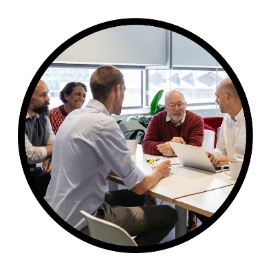 A group of people working together at a table.
