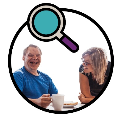 A magnifying glass above 2 people.