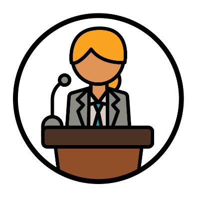 A person wearing a suit and standing at a podium.