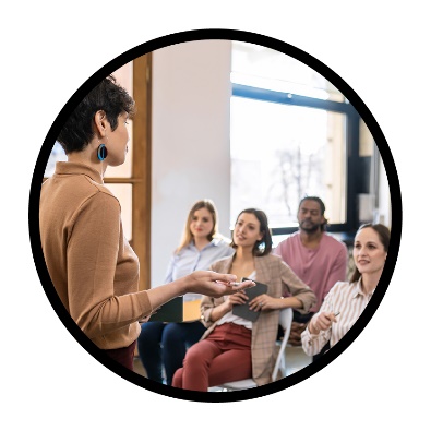 A person teaching a group of people.