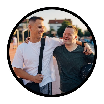 A person supporting a participant outside in their community. 