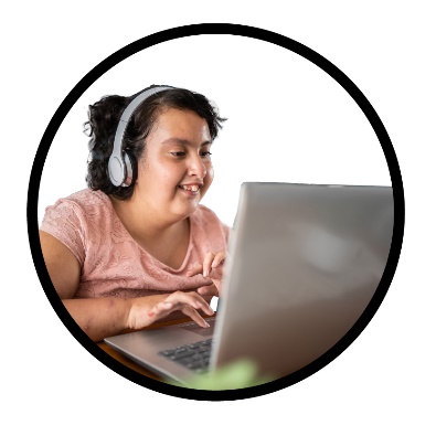A person using a laptop and headphones.