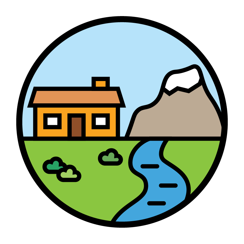 A house next to a river and a mountain.