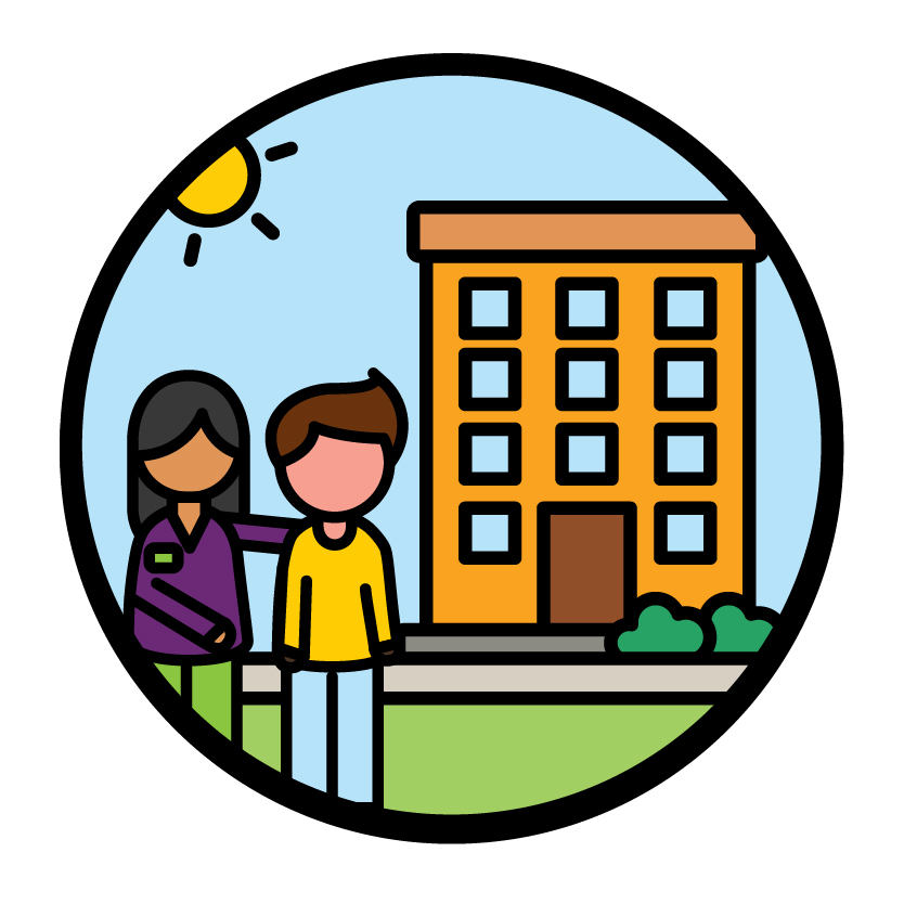 An NDIA worker supporting a participant. There is an apartment building behind them.