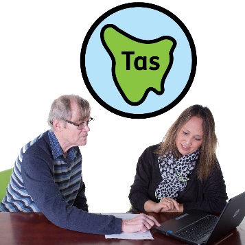 Two people sitting together looking at a computer with a Tasmania icon above them.
