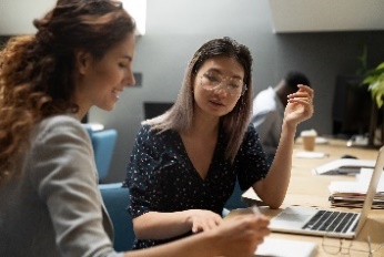 A group of people in a meeting. 