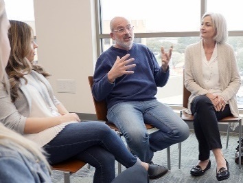 A group of people having a meeting.