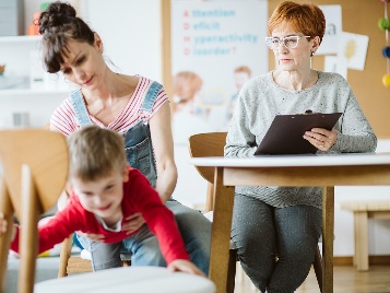 A parent and child attending a parenting class.