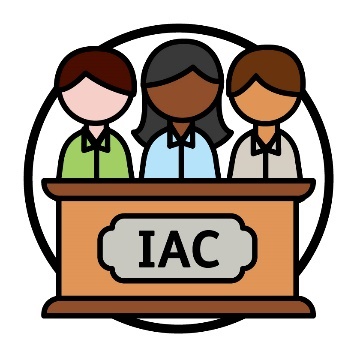 3 people behind a panel that says 'IAC'.