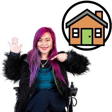 A smiling person in a wheelchair pointing to themself with their other hand raised and a house icon.