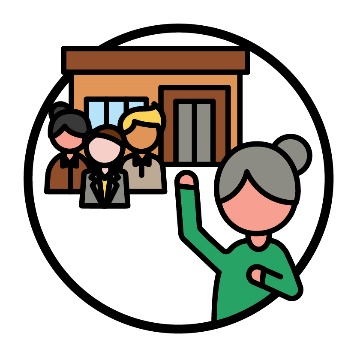 An older person raising their hand in front of 3 people from an organisation and an organisation building.