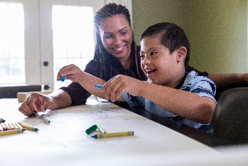 A person working with a child. 