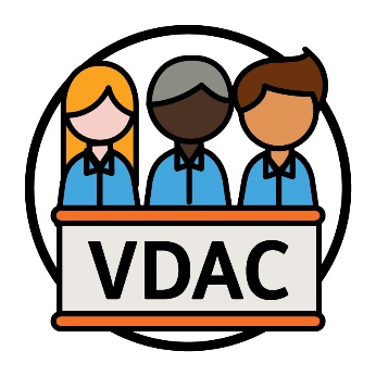 3 people behind a bench that has 'VDAC' printed on it.