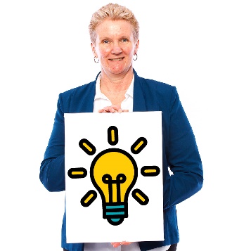 A person holding a sign with a glowing lightbulb on it.