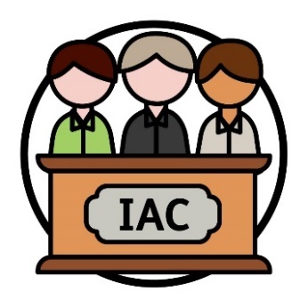 A group of people behind a lectern with a sign on it that reads 'IAC'.