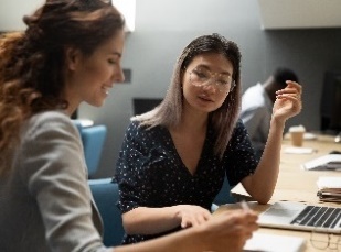 A group of people in a meeting. 