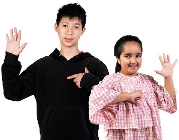2 children pointing at themselves and raising their hands.