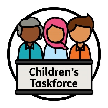 3 people behind a bench that has 'Children's Taskforce' on the front of it.