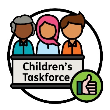 3 people behind a bench that has 'Children's Taskforce' on the front of it. Next to them is a thumbs up.
