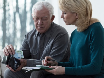 2 people filling out paperwork together.