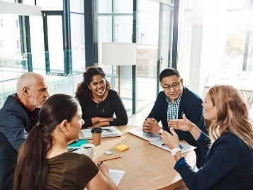 A group of professional people having a meeting.