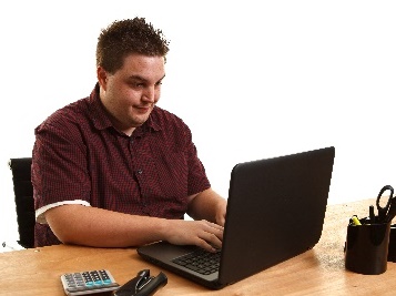 A person typing on a laptop.