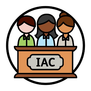 A group of people behind a lectern with 'IAC' printed on the front.