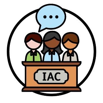 A group of people behind a lectern with 'IAC' printed on the front. They have a speech bubble with 3 dots in it.