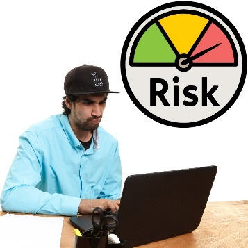 A person with intellectual disability using a laptop. Above them is a high risk icon.